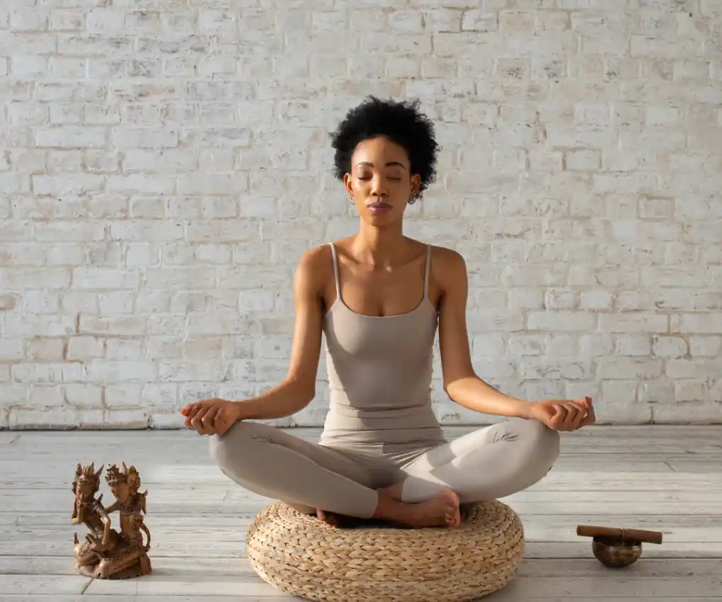 Women in meditation position showing mindfulness